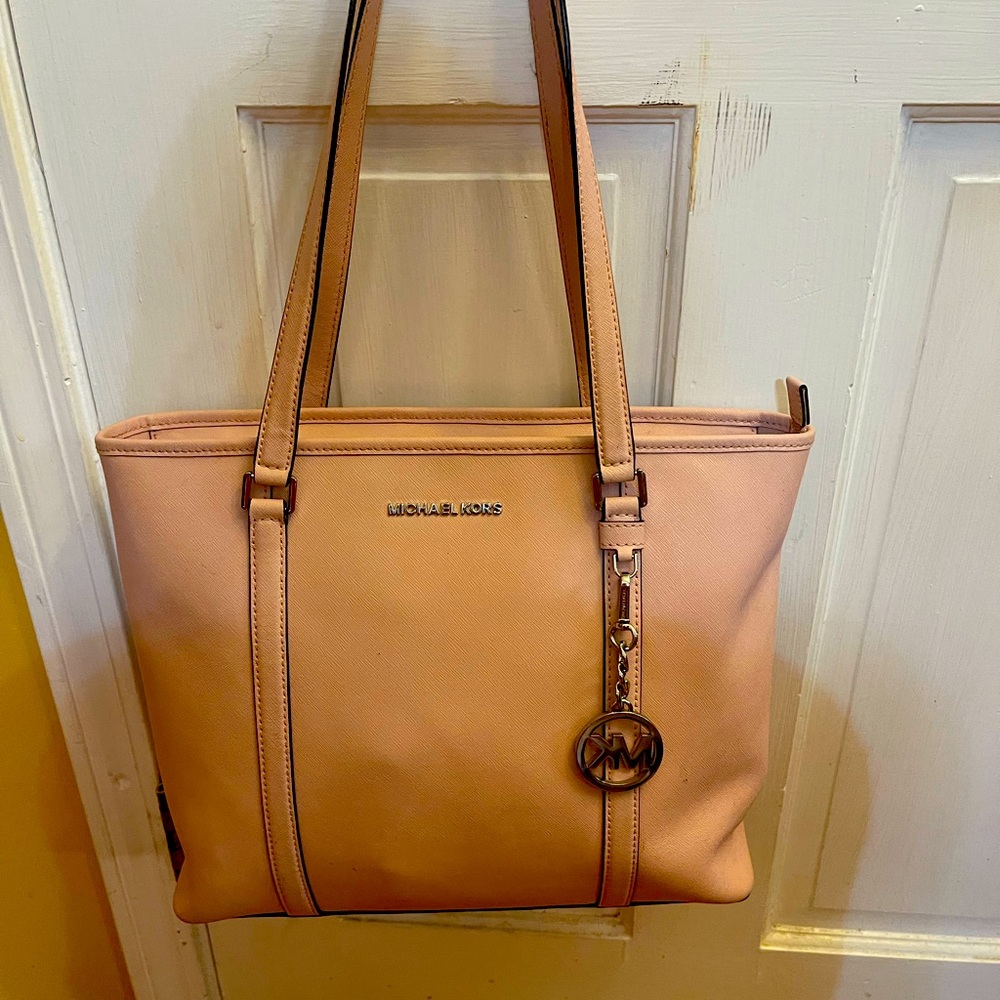 Light pink Michael Kors handbag.